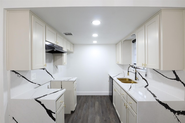 7706 Garsee Dr, Houston, TX 77040 - kitchen featuring under cabinet range hood, black dishwasher, dark wood-type flooring, light stone countertops, and recessed lighting