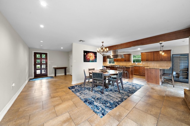 1213 Archley Dr, Hilshire Village, TX 77055 - dining area featuring healthy amount of natural light, recessed lighting, a chandelier, and light tile patterned floors