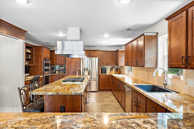 1213 Archley Dr, Hilshire Village, TX 77055 - kitchen featuring stainless steel appliances, light stone countertops, decorative backsplash, a center island, and open shelves