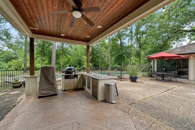1213 Archley Dr, Hilshire Village, TX 77055 - fenced backyard featuring exterior kitchen, ceiling fan, a patio, outdoor dining space, and view of wooded area