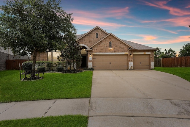 24506 Rossmore Hill Ct, Spring, TX 77389 - view of front of home with brick siding, an attached garage, and concrete driveway