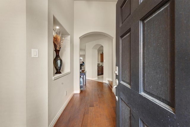 24506 Rossmore Hill Ct, Spring, TX 77389 - entrance foyer featuring wood finished floors and arched walkways