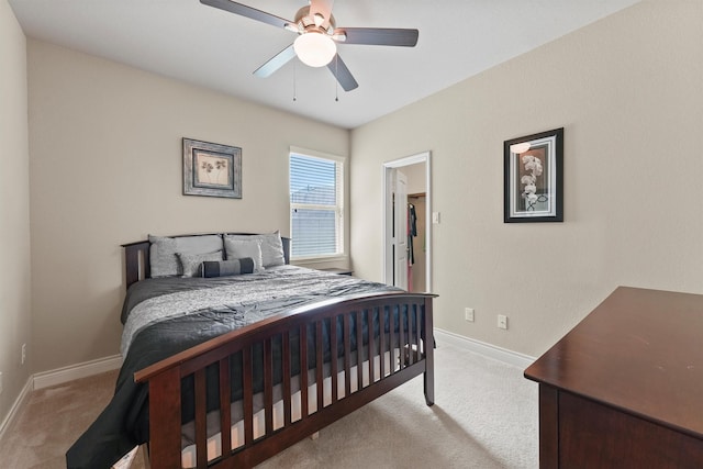 24506 Rossmore Hill Ct, Spring, TX 77389 - bedroom featuring light carpet, a ceiling fan, and a walk in closet