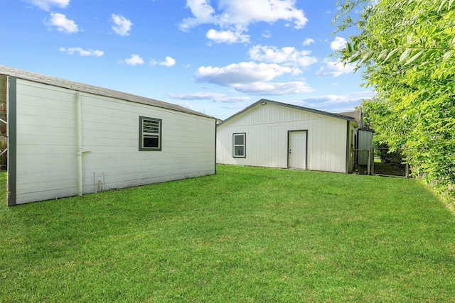 4715 Engleford St, Houston, TX 77026 - back of house featuring a lawn and an outdoor structure