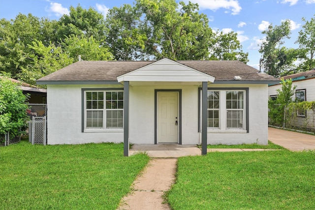 4715 Engleford St, Houston, TX 77026 - view of front of home with concrete block siding and roof with shingles