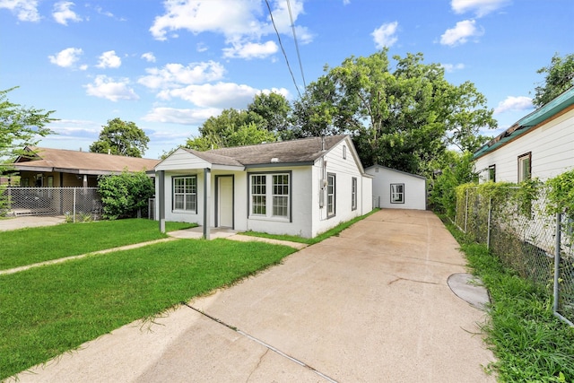 4715 Engleford St, Houston, TX 77026 - ranch-style home featuring concrete driveway, stucco siding, and a shingled roof