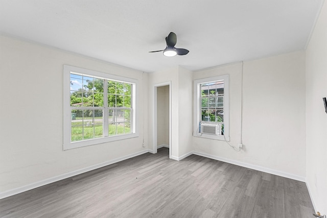 4715 Engleford St, Houston, TX 77026 - empty room with wood finished floors, cooling unit, and a ceiling fan