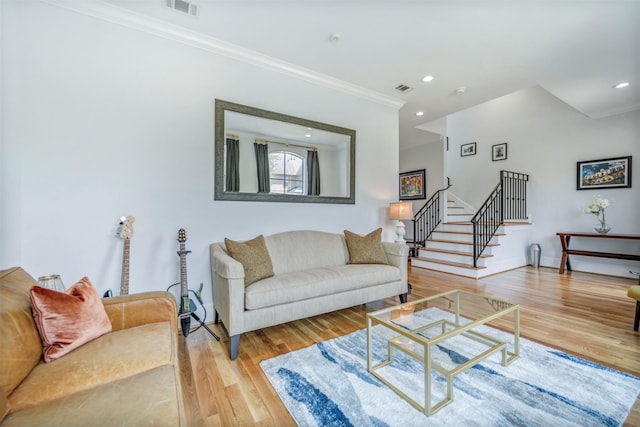 7119 Janet St, Houston, TX 77055 - living area featuring crown molding, stairs, wood finished floors, and recessed lighting