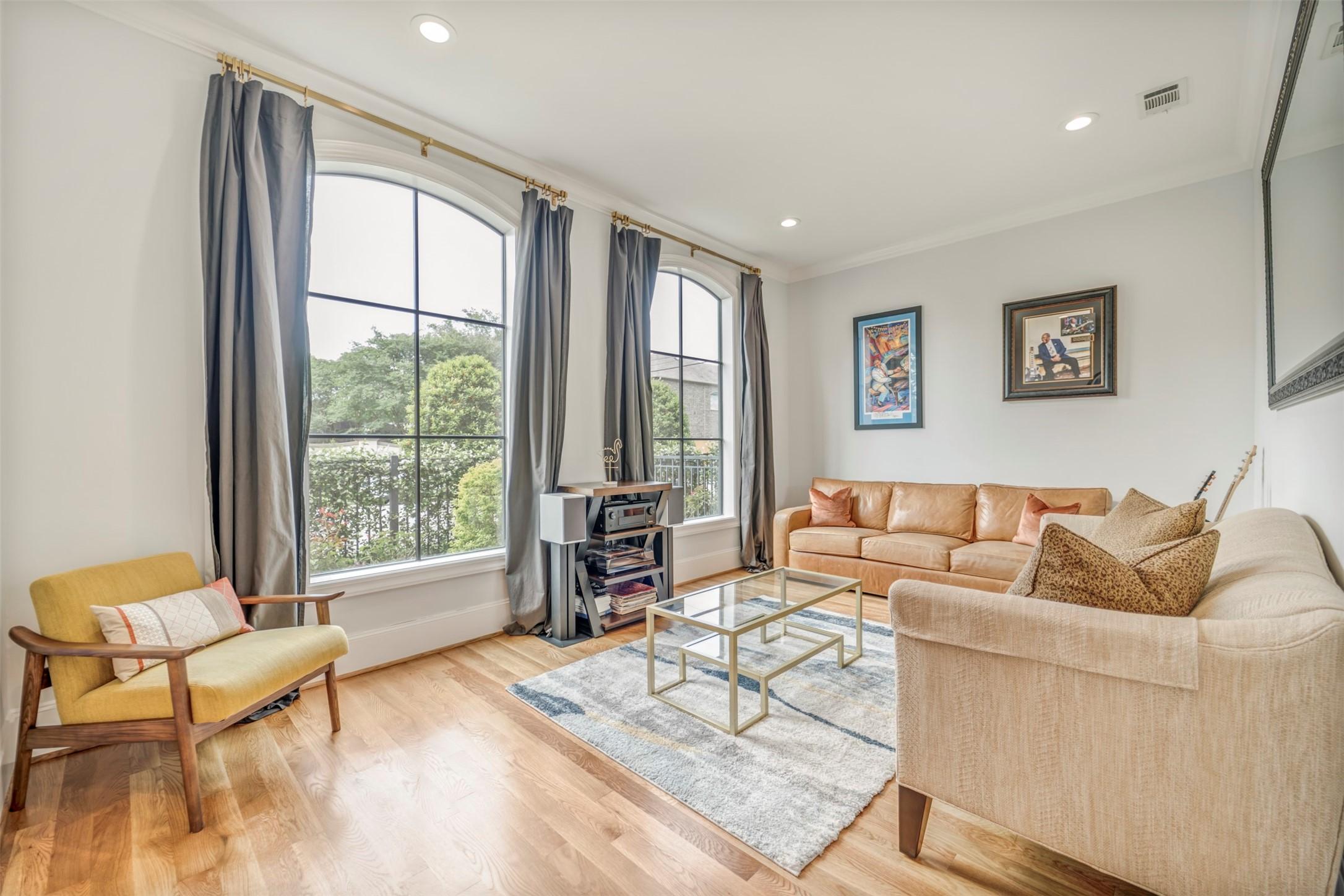 7119 Janet St, Houston, TX 77055 - living area with wood finished floors, recessed lighting, and ornamental molding