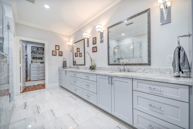 7119 Janet St, Houston, TX 77055 - full bathroom with a marble finish shower, double vanity, crown molding, marble look tiles, and recessed lighting