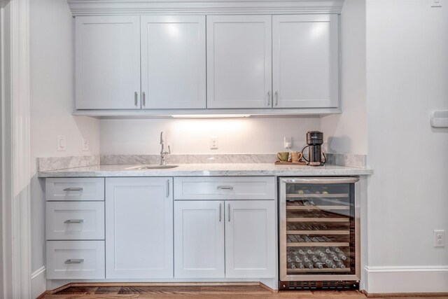 7119 Janet St, Houston, TX 77055 - indoor wet bar with beverage cooler and light wood-type flooring