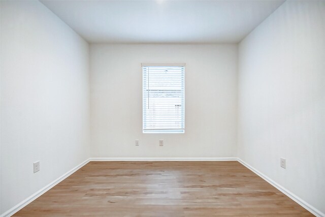9603 Fulvetta Briar Ct, Baytown, TX 77521 - empty room featuring light wood finished floors and baseboards