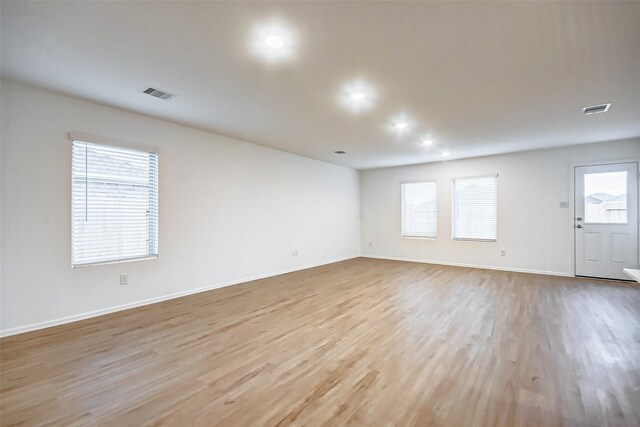 9603 Fulvetta Briar Ct, Baytown, TX 77521 - spare room featuring light wood finished floors and recessed lighting