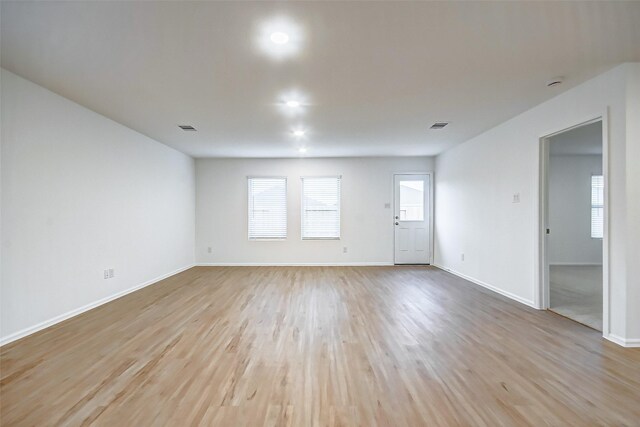 9603 Fulvetta Briar Ct, Baytown, TX 77521 - spare room with light wood finished floors and plenty of natural light