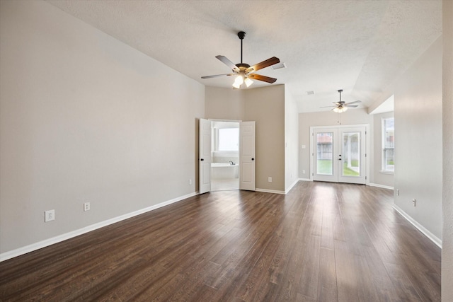 2219 Fenton Rock Ln, Katy, TX 77494 - unfurnished living room with a ceiling fan, dark wood-style flooring, french doors, a textured ceiling, and lofted ceiling