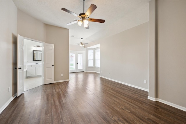 2219 Fenton Rock Ln, Katy, TX 77494 - unfurnished living room featuring a ceiling fan, dark wood-type flooring, and lofted ceiling