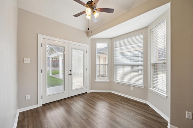 2219 Fenton Rock Ln, Katy, TX 77494 - doorway featuring french doors, dark wood-style flooring, and a ceiling fan