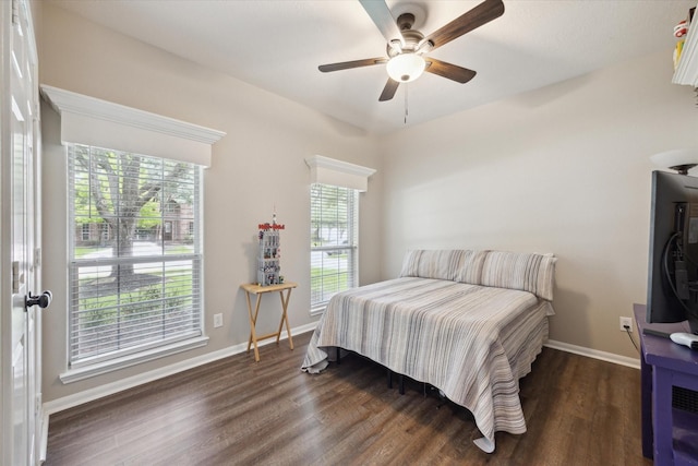 2219 Fenton Rock Ln, Katy, TX 77494 - bedroom with dark wood-style floors and ceiling fan