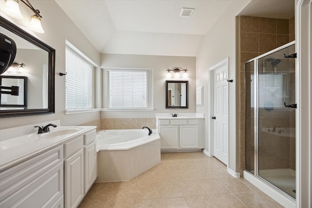 2219 Fenton Rock Ln, Katy, TX 77494 - bathroom with two vanities, a stall shower, a bath, tile patterned flooring, and vaulted ceiling