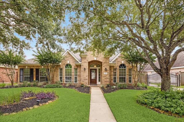 2219 Fenton Rock Ln, Katy, TX 77494 - traditional-style house featuring brick siding