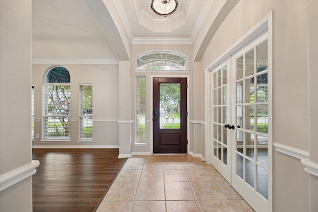 2219 Fenton Rock Ln, Katy, TX 77494 - entryway with french doors, crown molding, arched walkways, wood finished floors, and a tray ceiling