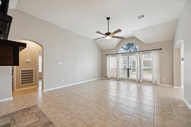 2219 Fenton Rock Ln, Katy, TX 77494 - unfurnished room featuring arched walkways, ceiling fan, vaulted ceiling, and light tile patterned flooring