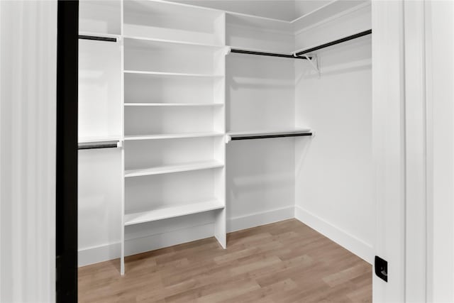 8136 Chateau St, Houston, TX 77028 - spacious closet featuring wood finished floors