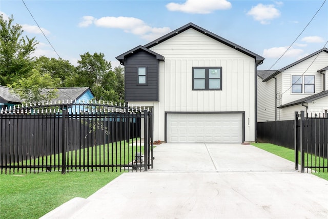 8136 Chateau St, Houston, TX 77028 - view of front of house featuring a garage, concrete driveway, and board and batten siding
