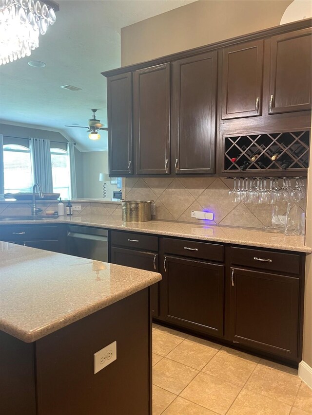 6315 Oakmont Creek Dr, Spring, TX 77379 - kitchen with dishwasher, tasteful backsplash, ceiling fan, light tile patterned flooring, and lofted ceiling