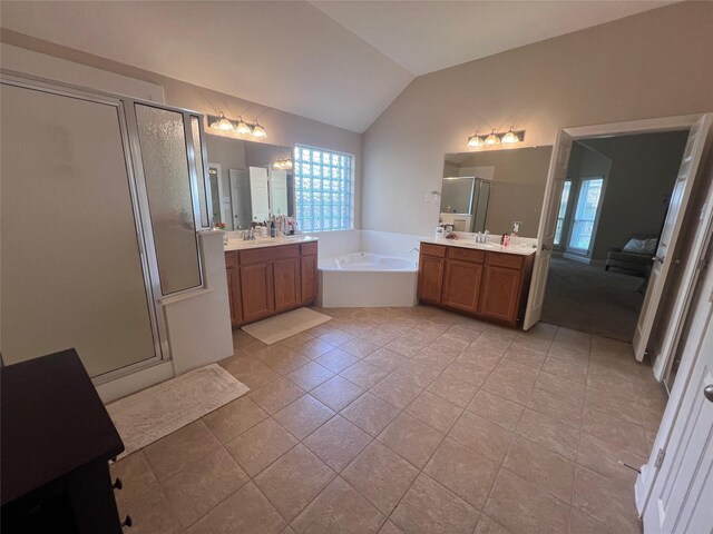 6315 Oakmont Creek Dr, Spring, TX 77379 - bathroom with a stall shower, two vanities, a garden tub, and lofted ceiling
