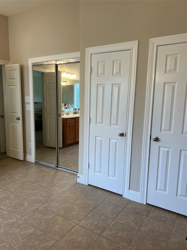 6315 Oakmont Creek Dr, Spring, TX 77379 - unfurnished bedroom with tile patterned flooring and a closet