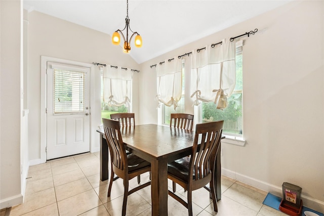 12747 Bridle Springs Ln, Houston, TX 77044 - dining space with light tile patterned floors, lofted ceiling, and a chandelier