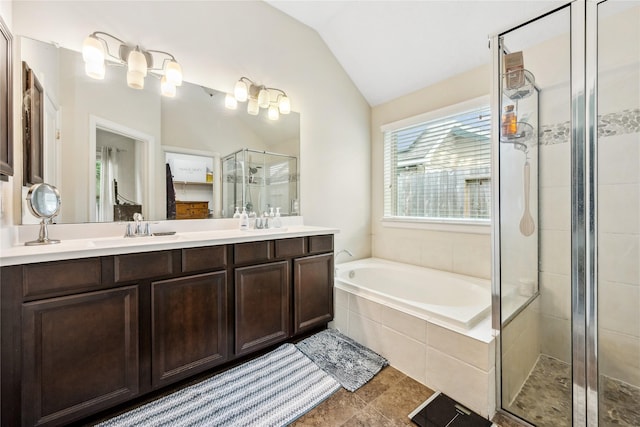 12747 Bridle Springs Ln, Houston, TX 77044 - bathroom featuring vaulted ceiling, a stall shower, double vanity, and a garden tub