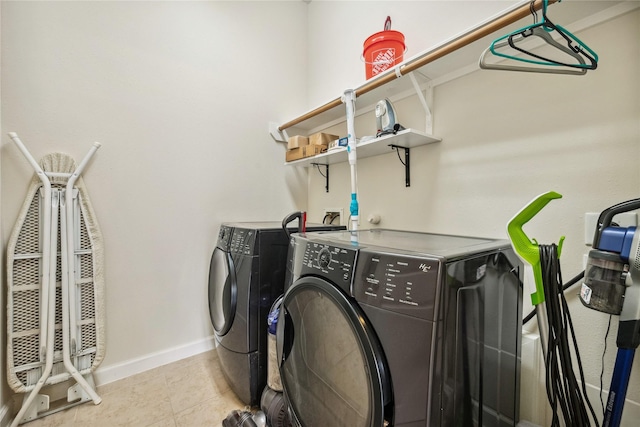 12747 Bridle Springs Ln, Houston, TX 77044 - laundry room with independent washer and dryer and light tile patterned flooring
