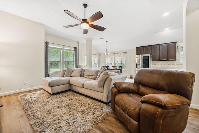 12747 Bridle Springs Ln, Houston, TX 77044 - living area with a ceiling fan, wood finished floors, decorative columns, lofted ceiling, and recessed lighting