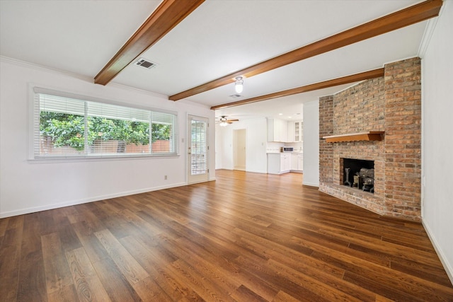 5707 Darnell St, Houston, TX 77096 - unfurnished living room featuring wood finished floors, beam ceiling, a fireplace, and a ceiling fan