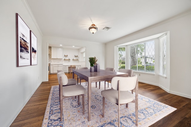 5707 Darnell St, Houston, TX 77096 - dining area with dark wood-style flooring and ornamental molding