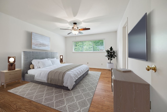 5707 Darnell St, Houston, TX 77096 - bedroom with light wood-style flooring and ceiling fan
