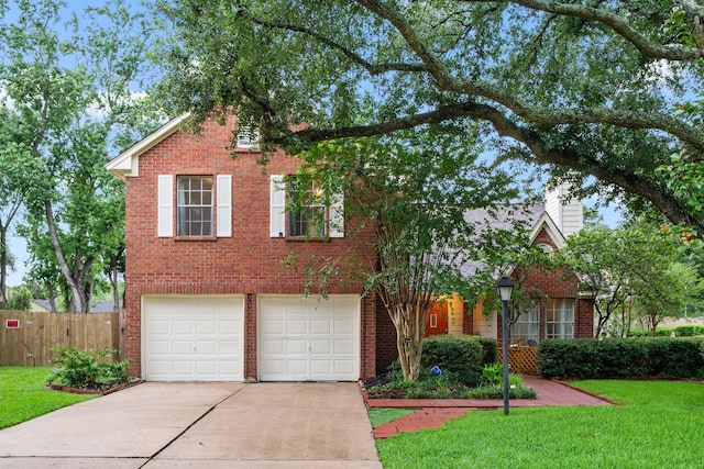 902 Mesa Terrace Dr, Katy, TX 77450 - traditional-style home featuring brick siding, driveway, an attached garage, and a chimney