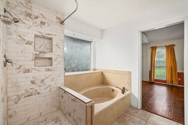 902 Mesa Terrace Dr, Katy, TX 77450 - bathroom featuring a bath, a tile shower, and tile patterned floors