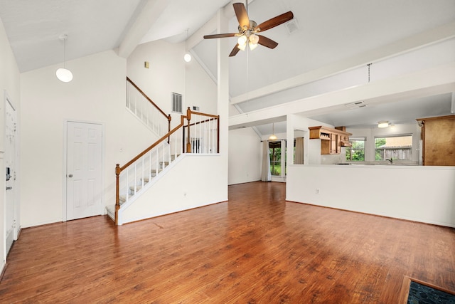 902 Mesa Terrace Dr, Katy, TX 77450 - unfurnished living room with ceiling fan, wood finished floors, high vaulted ceiling, beamed ceiling, and stairs