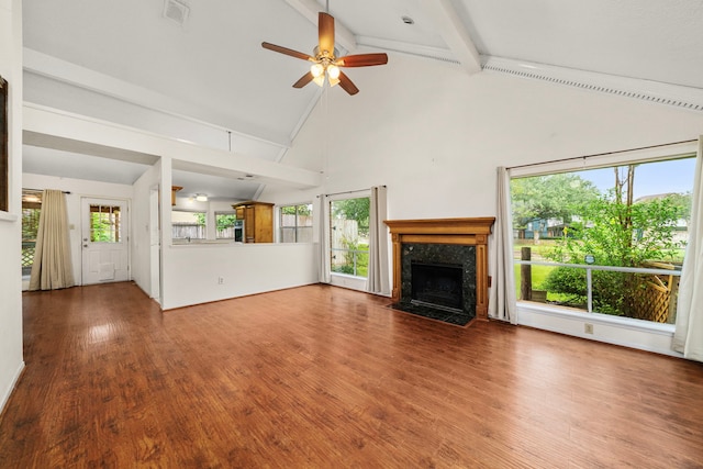 902 Mesa Terrace Dr, Katy, TX 77450 - unfurnished living room featuring high vaulted ceiling, beam ceiling, a fireplace, ceiling fan, and wood finished floors