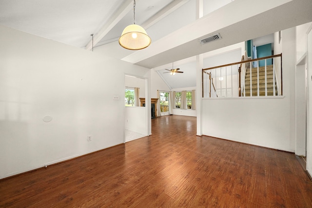 902 Mesa Terrace Dr, Katy, TX 77450 - unfurnished living room featuring beamed ceiling, high vaulted ceiling, ceiling fan, wood finished floors, and stairs