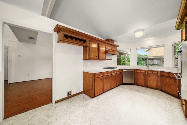 902 Mesa Terrace Dr, Katy, TX 77450 - kitchen with dishwasher, gas cooktop, light flooring, light countertops, and plenty of natural light