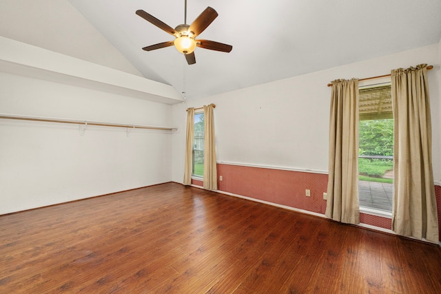 902 Mesa Terrace Dr, Katy, TX 77450 - spare room featuring hardwood / wood-style floors, healthy amount of natural light, a ceiling fan, high vaulted ceiling, and a wainscoted wall