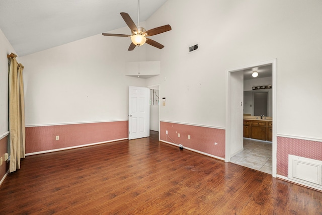 902 Mesa Terrace Dr, Katy, TX 77450 - unfurnished room with wood finished floors, a ceiling fan, wainscoting, and high vaulted ceiling