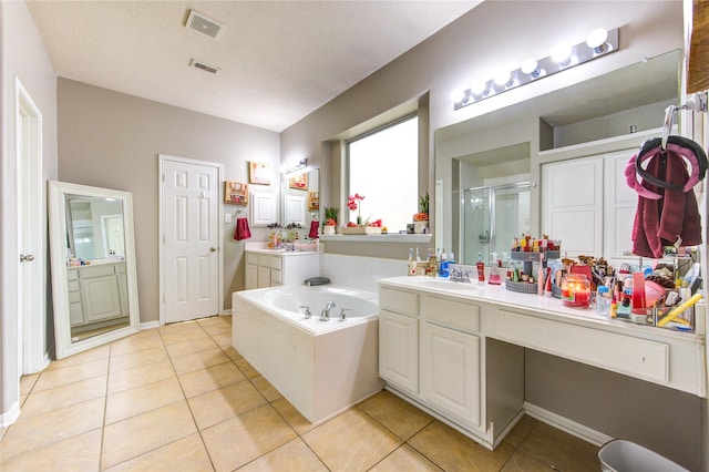 24811 Corbin Gate Dr, Spring, TX 77389 - full bathroom featuring a stall shower, tile patterned flooring, a bath, and vanity