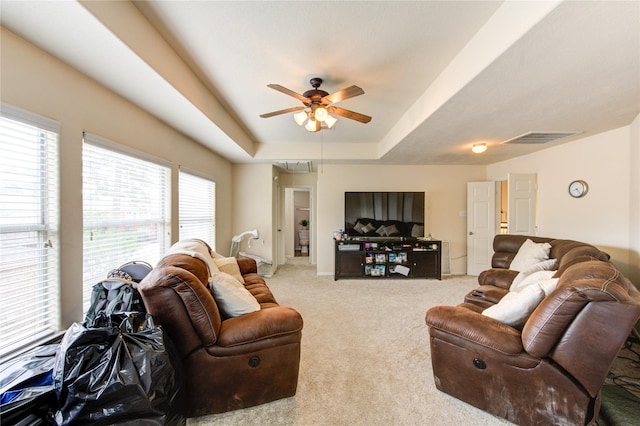 24811 Corbin Gate Dr, Spring, TX 77389 - carpeted living area featuring attic access, ceiling fan, and a tray ceiling