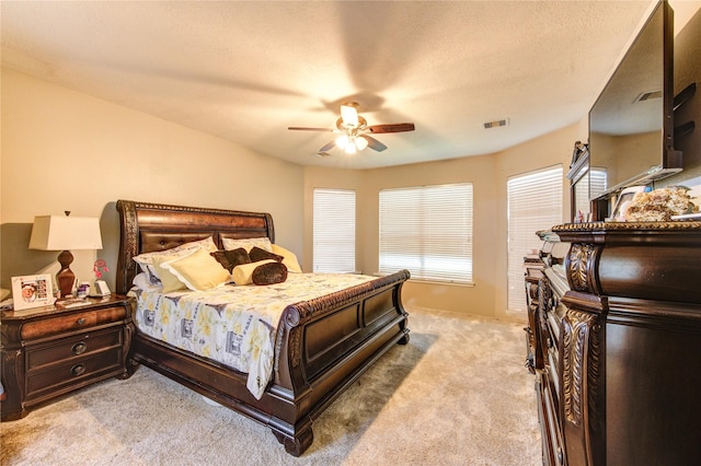 24811 Corbin Gate Dr, Spring, TX 77389 - bedroom featuring light colored carpet, multiple windows, and ceiling fan