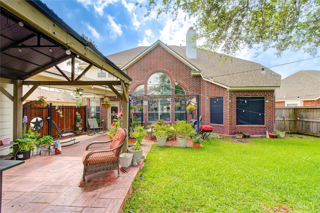 24811 Corbin Gate Dr, Spring, TX 77389 - rear view of property with brick siding, a gazebo, a fenced backyard, a patio area, and a shingled roof
